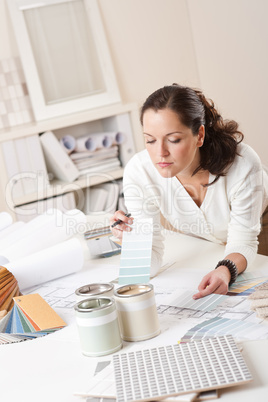 Female interior designer working at office