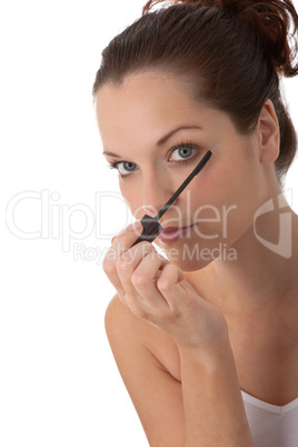 Body care series - Beautiful woman applying mascara