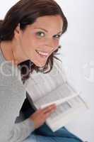 Smiling happy woman with book