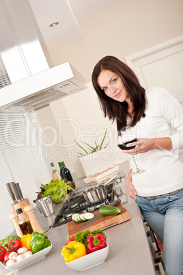 Young woman with glass of red wine