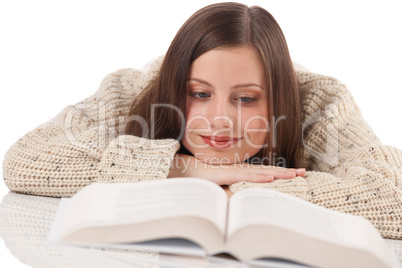 Portrait of young happy woman with book wearing turtleneck