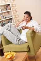 Students - Happy female teenager with potato chips