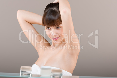 Body care: Young woman in bathroom