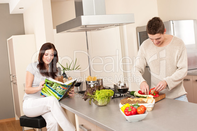 Young couple cooking in kitchen together