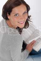 Smiling happy woman with book