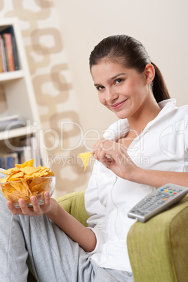 Students - Happy female teenager with potato chips