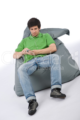 Young man with ear buds listening to music