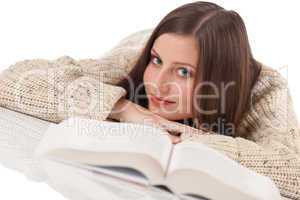 Portrait of young happy woman with book wearing turtleneck