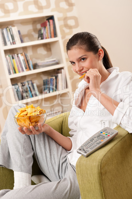 Students - Happy female teenager with potato chips