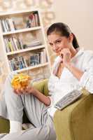 Students - Happy female teenager with potato chips