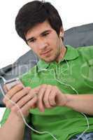 Young man with ear buds listening to music