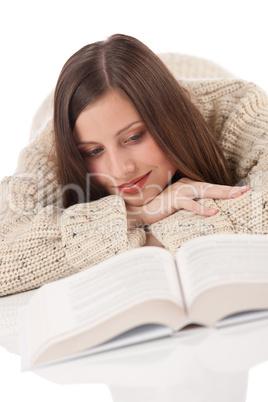 Portrait of young happy woman with book