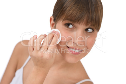 Body care - Female teenager cleaning face
