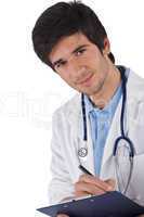 Male student doctor with stethoscope writing