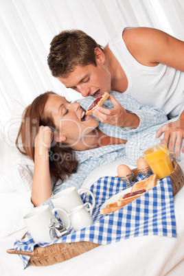 Young man and woman having breakfast together