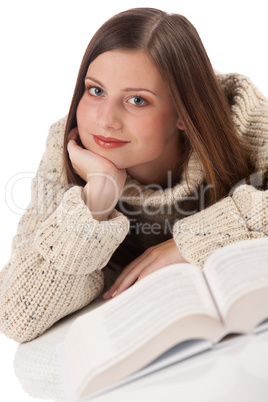 Portrait of young happy woman with book wearing turtleneck