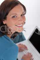 Smiling happy woman with white laptop