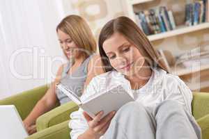 Students - Two female students studying in living room