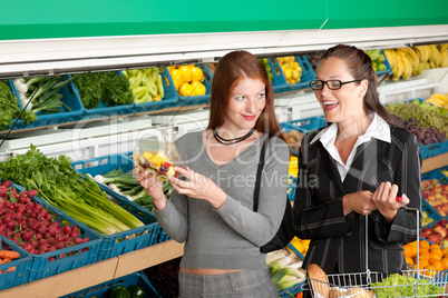 Grocery store shopping - Two business women