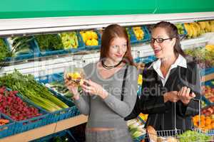 Grocery store shopping - Two business women