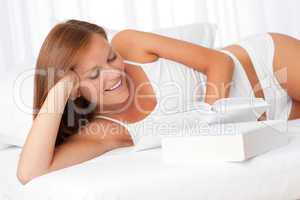 White lounge - Smiling woman reading book