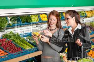 Grocery store shopping - Two business women