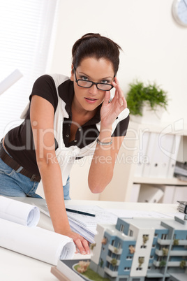 Young architect with glasses working at modern office