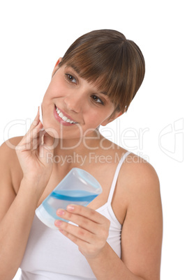 Body care - Female teenager cleaning face