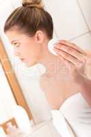 Body care series - Young woman cleaning her face