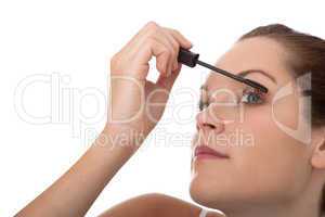 Body care series - Young brown hair woman applying mascara