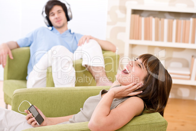 Student - Happy teenagers listen to music