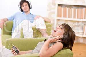 Student - Happy teenagers listen to music