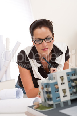 Young architect with glasses working at modern office
