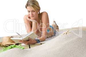 Beach - Starfish on sand, woman in background