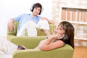 Student - Happy teenagers listen to music