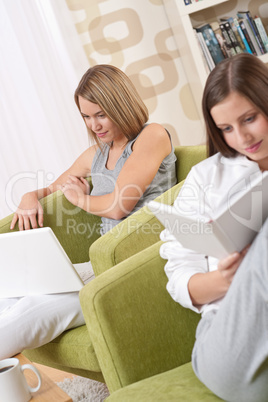 Students - Two female students studying in living room