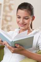 Students - Female teenager reading book