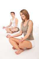 Fitness - Healthy couple stretching in yoga position