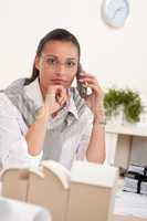 Young female architect with phone