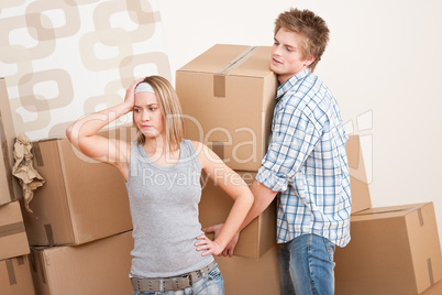 Moving house: Man and woman with box