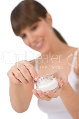 Body care - Female teenager applying moisturizer