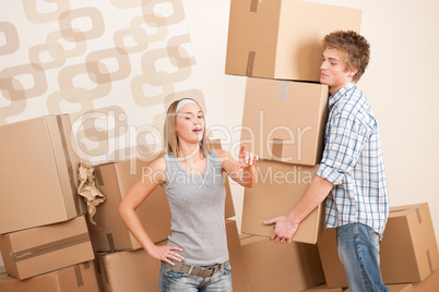 Moving house: Man and woman with box