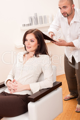 Professional hairdresser cut with scissors at salon