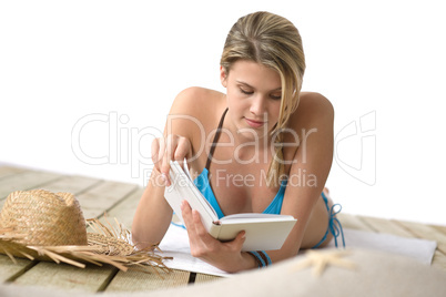 Beach - Young woman relax in bikini with book Beach - Young woman relax in bikini with book