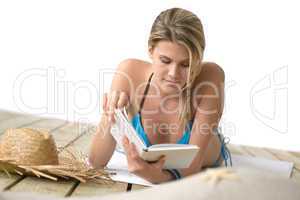 Beach - Young woman relax in bikini with book