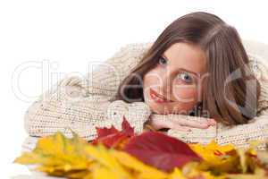 Autumn portrait of beautiful woman with leaf wearing turtleneck