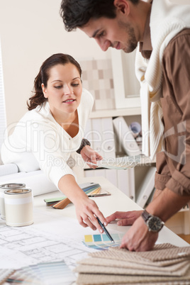 Two interior designer working at office with color swatch