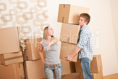 Moving house: Man and woman with box