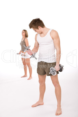 Fitness - Young healthy couple with weights