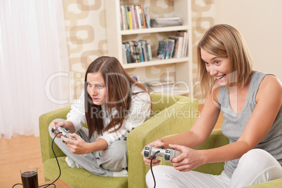 Students - Two female teenager playing video TV game